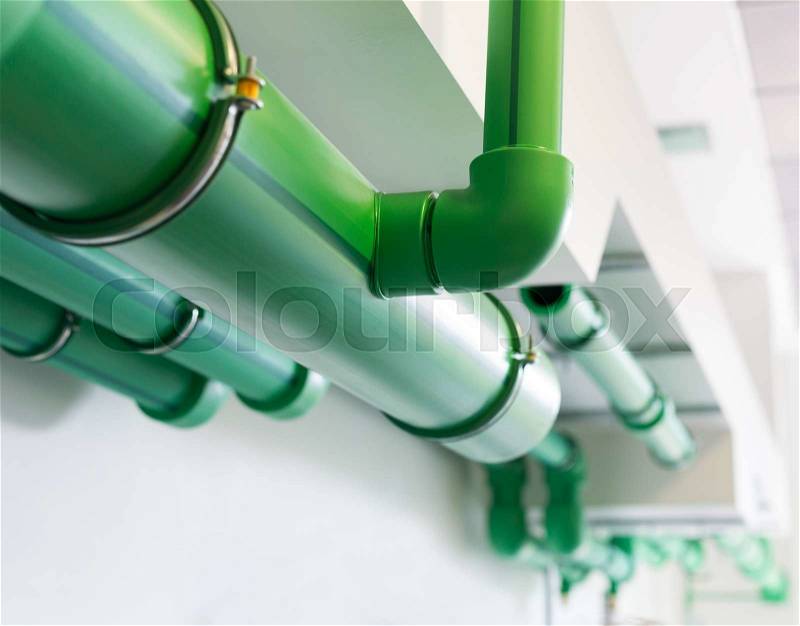 Green pipelines - water supply system, stock photo