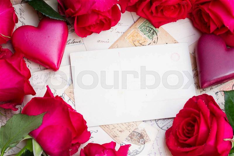 Vintage mail with frame of hearts and fresh roses, stock photo