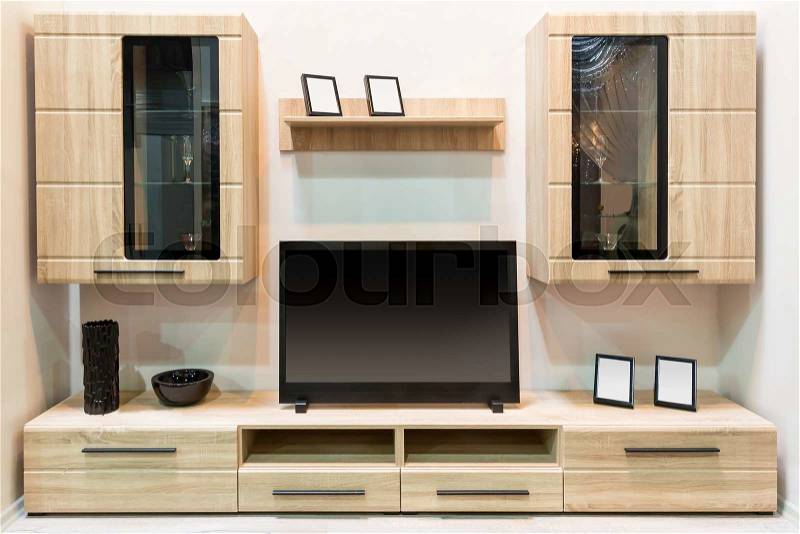 Modern wooden furniture with TV set, stock photo