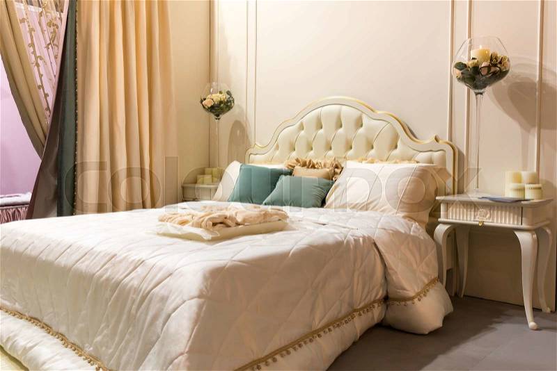 Vintage bedroom interior. Bed and pillows, stock photo