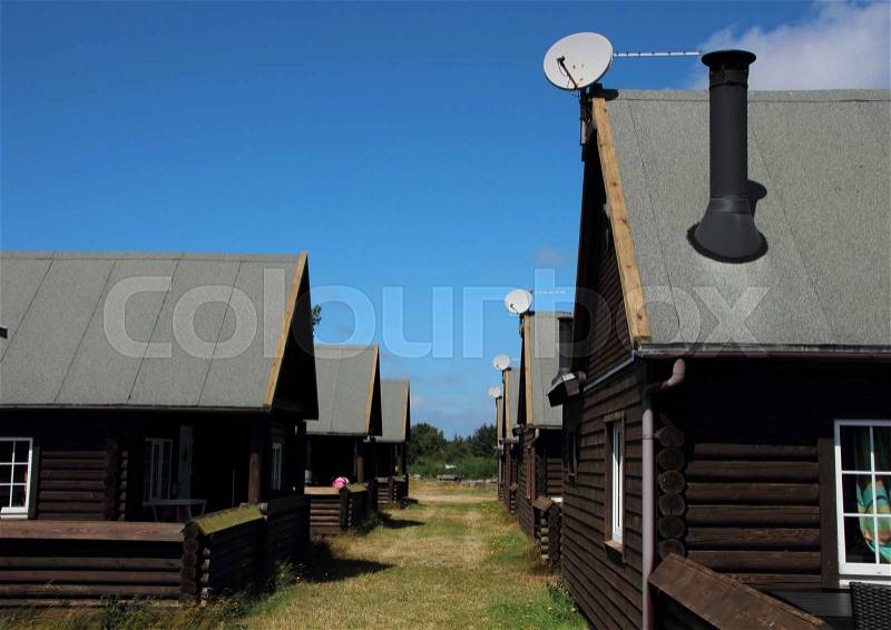 Alley with Asphalt Roof Summer Houses and Satellite Dish in Daylight, stock photo