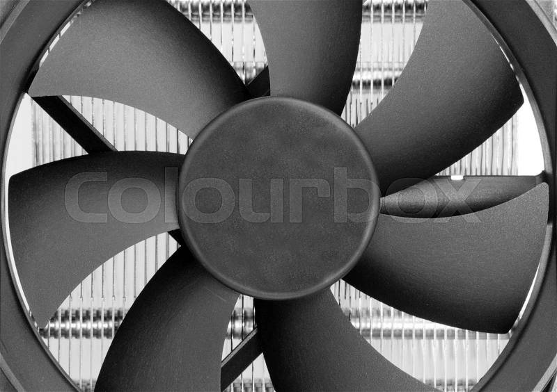 Fan blades of computer processor cooler. Close-up view, stock photo