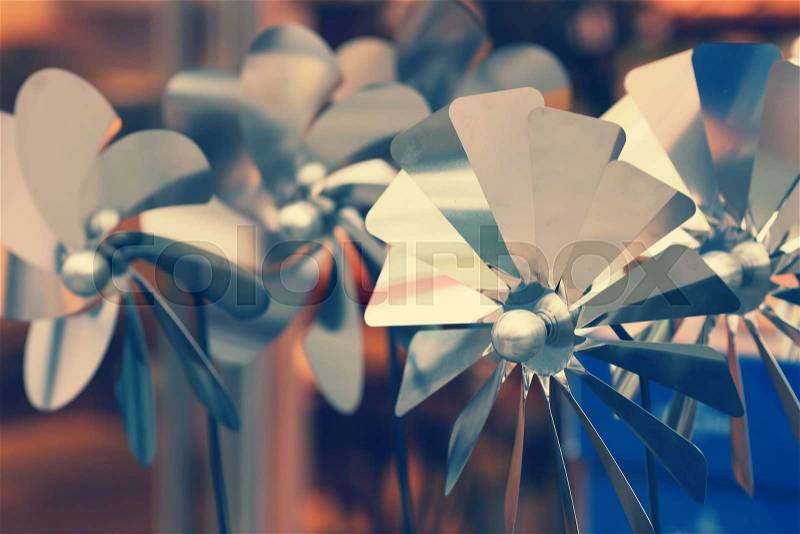 Closeup of metal toy windmills, stock photo