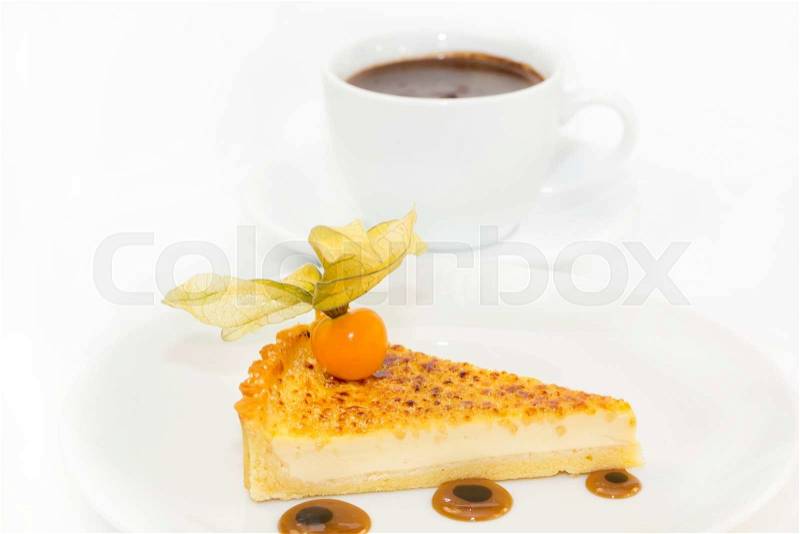 Piece of cake with passion fruit and a cup of hot chocolate, stock photo