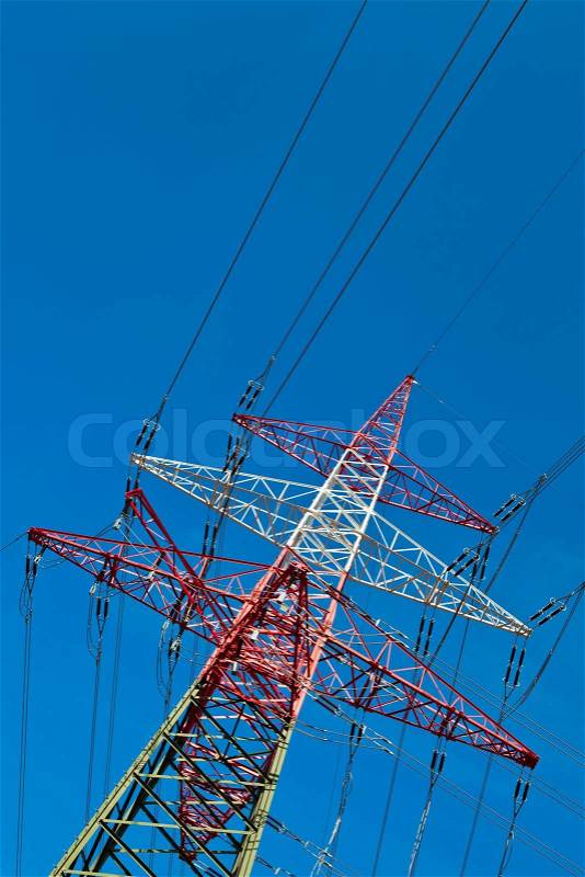 Poles of a high-voltage power line. Production and transportation of energy, stock photo