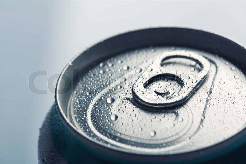 Aluminum can with water drops isolated on gray, stock photo
