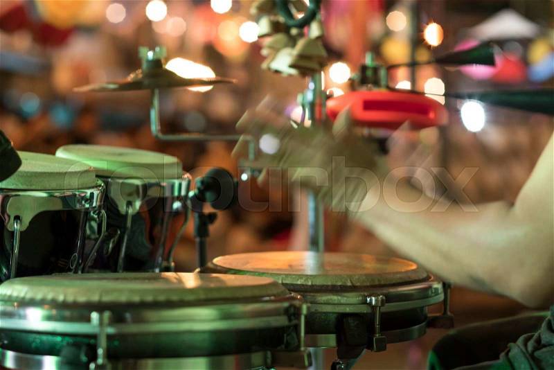 Hands on percussion, Street music background. Motion blur, stock photo