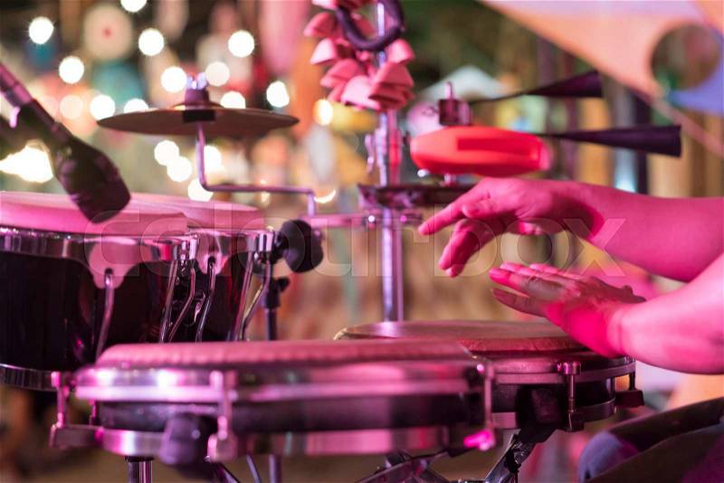 Hands on percussion, Street music background, stock photo