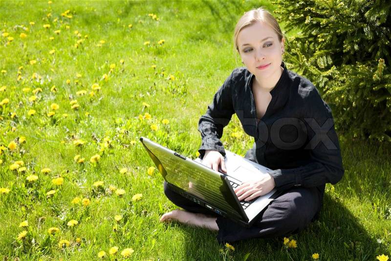 Young Lady Working Outside On Laptop Computer, stock photo