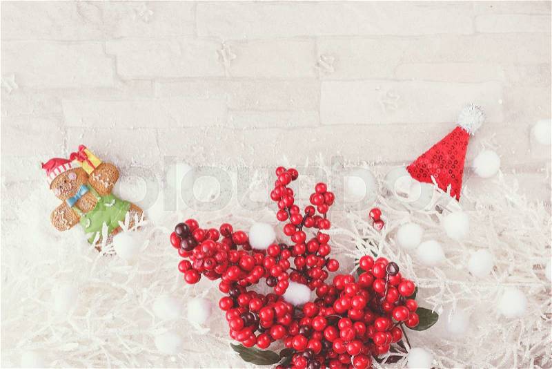Christmas and New Year decoration background. Red and white Christmas arrangement with white fir branches, gingerbread and Christmas decoration. Top view, vintage color filter, blank space, stock photo