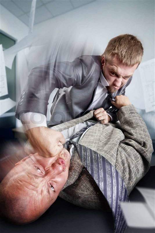 Two furious businessmen are fighting on the table, stock photo