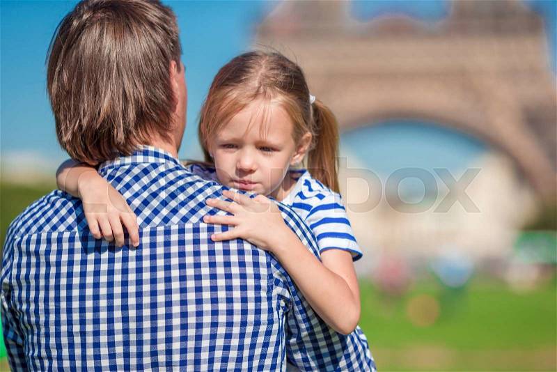 Happy family in Paris background Eiffel Tower. French summer holidays, travel and people concept, stock photo