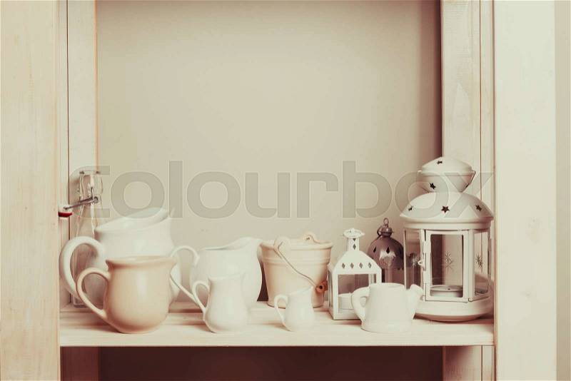 Shelves in the rack in the kitchen at shabby chic style, stock photo