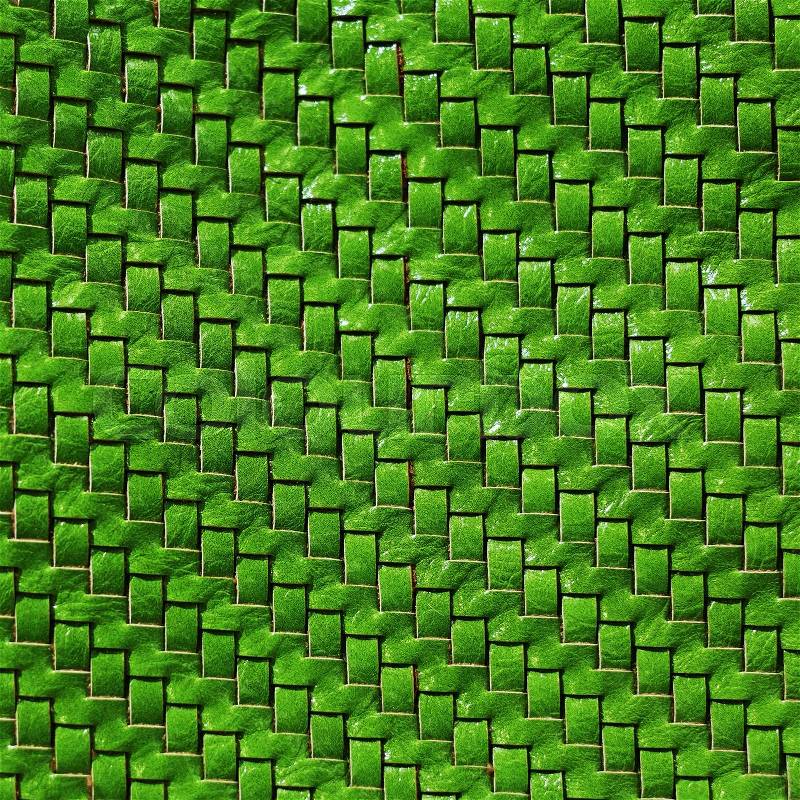 Braided leather texture. Green leather background. Front view, stock photo