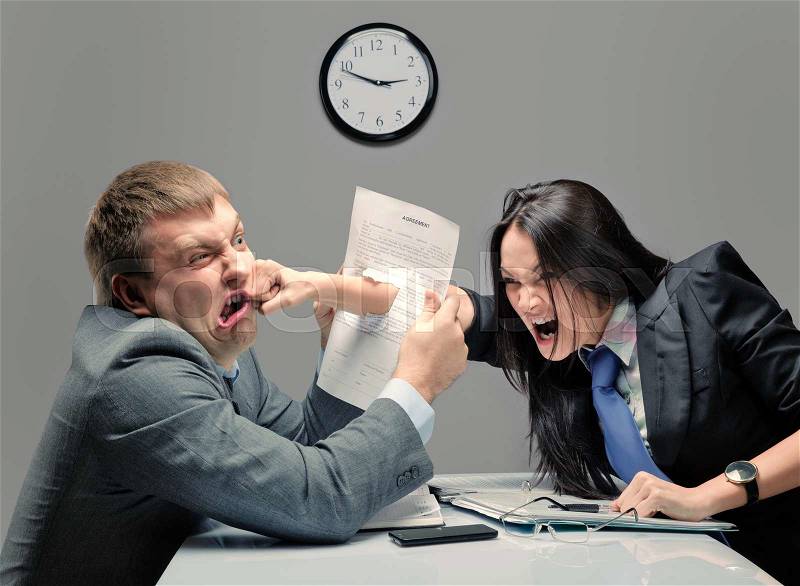 Two young caucasian office worker starting to fight, stock photo