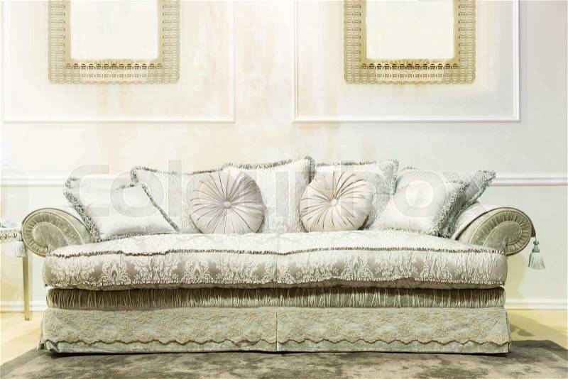 Luxury interior with nice big white sofa, stock photo