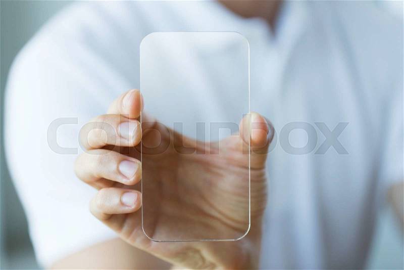 Business, technology and people concept - close up of male hand holding and showing transparent smartphone at office, stock photo