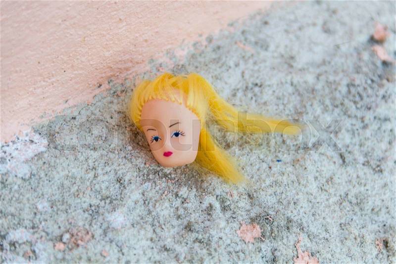 Head of woman doll on the floor, stock photo