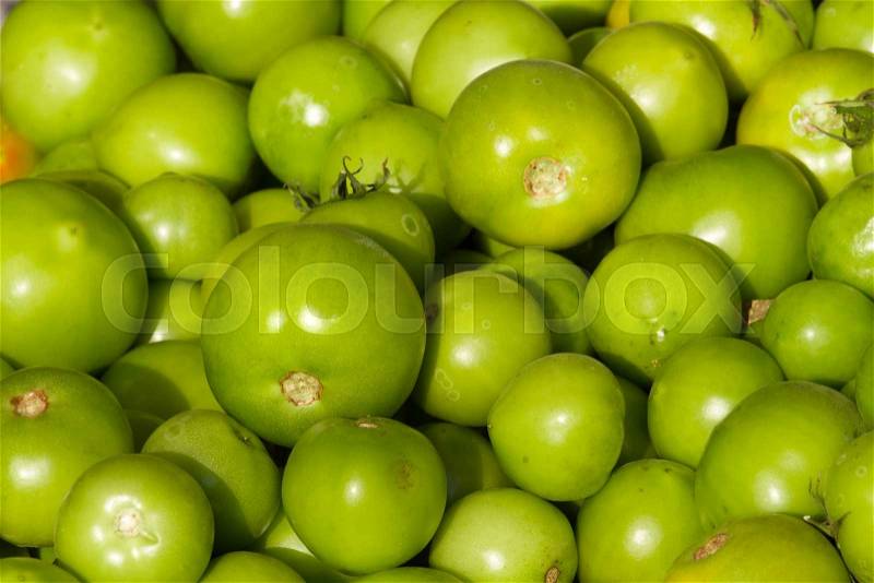Background of groups of immature tomato market. Agriculture, stock photo