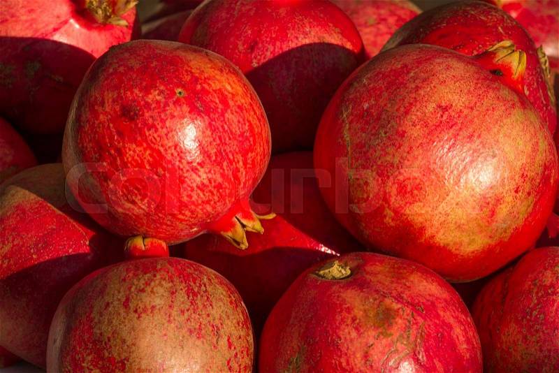 Red pomegranate background. Organic fresh product. Agriculture, stock photo