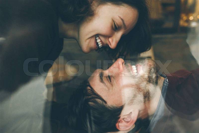 Vintage couple hugs and laughing .Coffee shop. instagram toned, stock photo