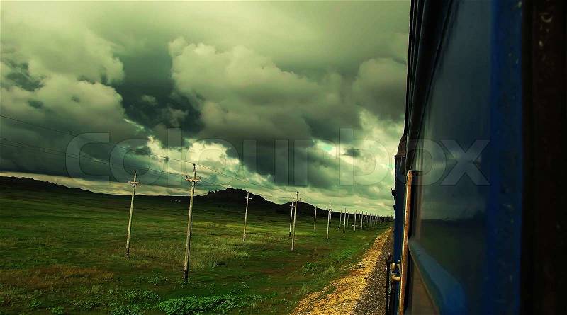 High speed train on the railway and landscape with clouds, transport and travel, photo art, stock photo