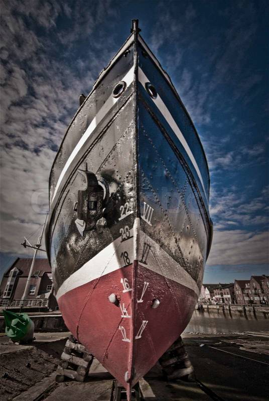 Close-up fishing boat on land in Husum, Germany, stock photo