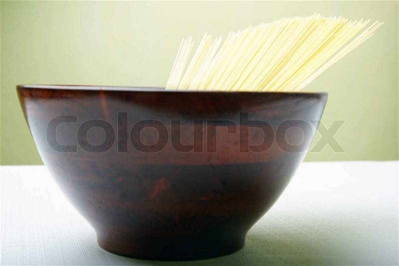 Close-up photo of the Italian pasta in the brown cup. Depth of field added by the macro lens for natural view, stock photo