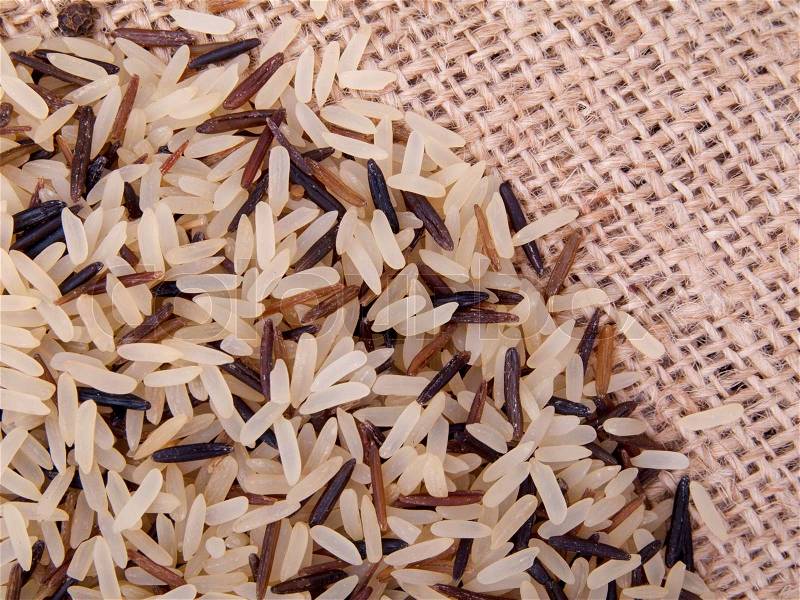 Pile of wild rice on canvas, stock photo