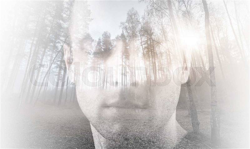 Young man, portrait with closed eyes combined with forest landscape, double exposure photo effect, stock photo