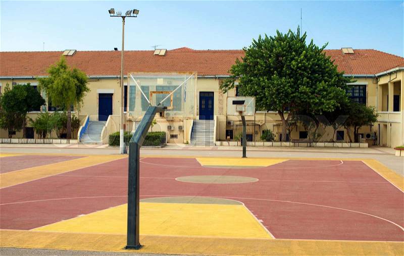 Basketball court in the backyard of the school, stock photo