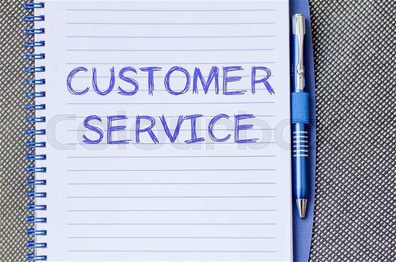 Customer service text concept write on notebook with pen, stock photo