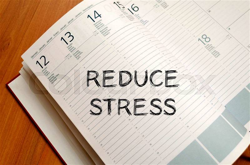 Reduce stress text concept write on notebook with pen, stock photo