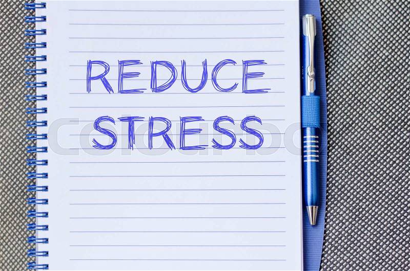 Reduce stress text concept write on notebook with pen, stock photo