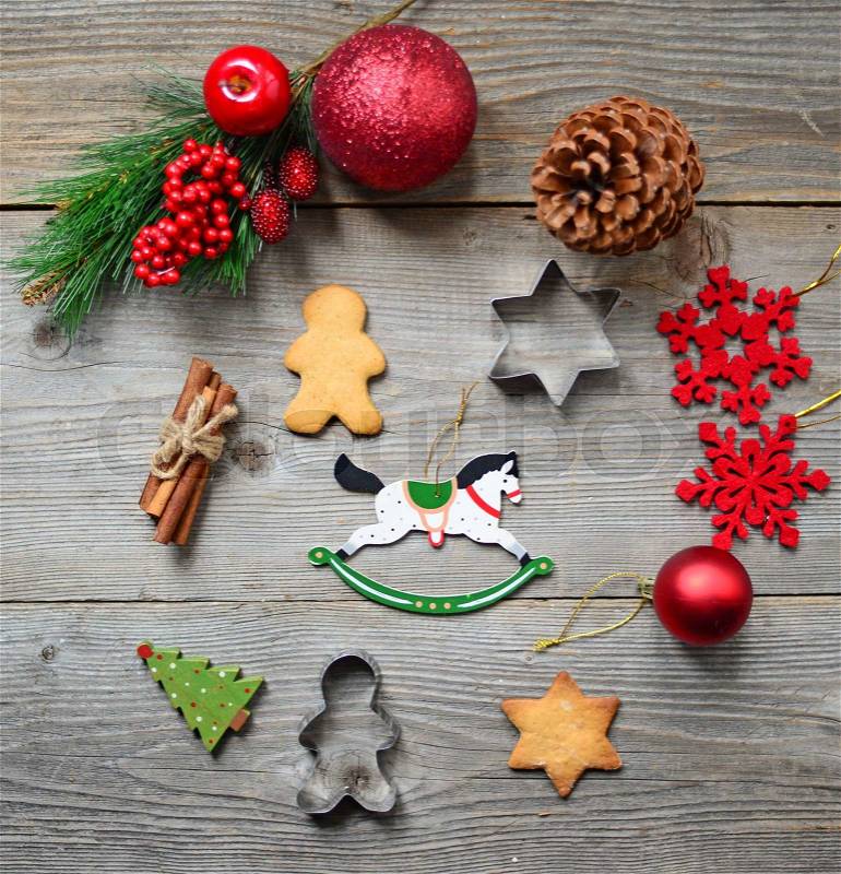Christmas cookies and ornaments on wooden background, stock photo