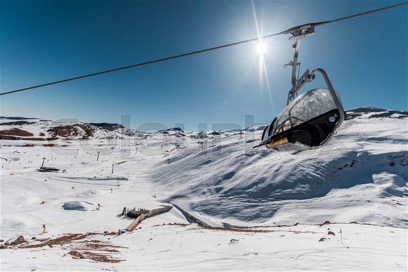 Ski lifts durings bright winter day, stock photo