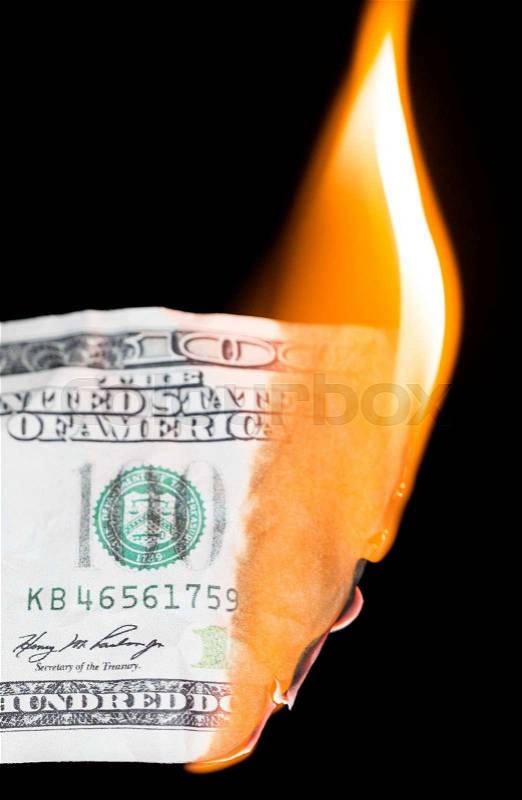 100 dollars burning on a black background, stock photo