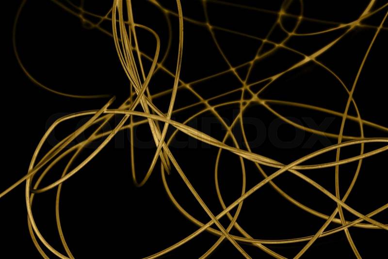 Yellow cable on the black background. The inversion, stock photo