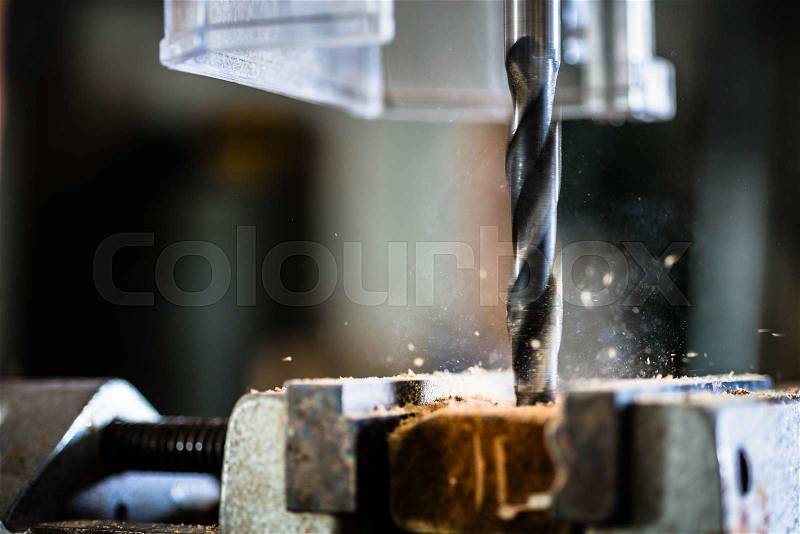 Work with power drill in workshop of carpenter, stock photo