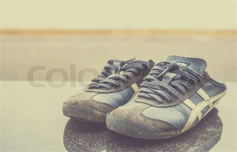 Old Running Shoes. Vintage filter, stock photo