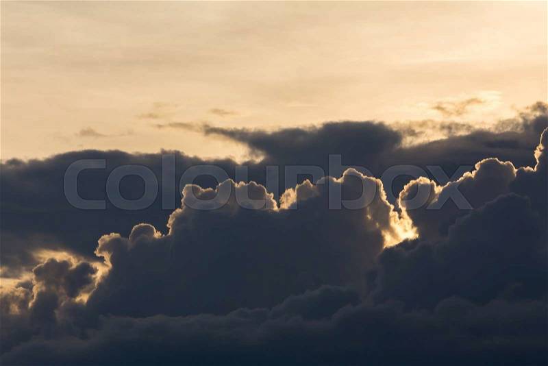 Beautiful sunset sky, dramatic moody sky, black cloudy on yellow light sky background, stock photo