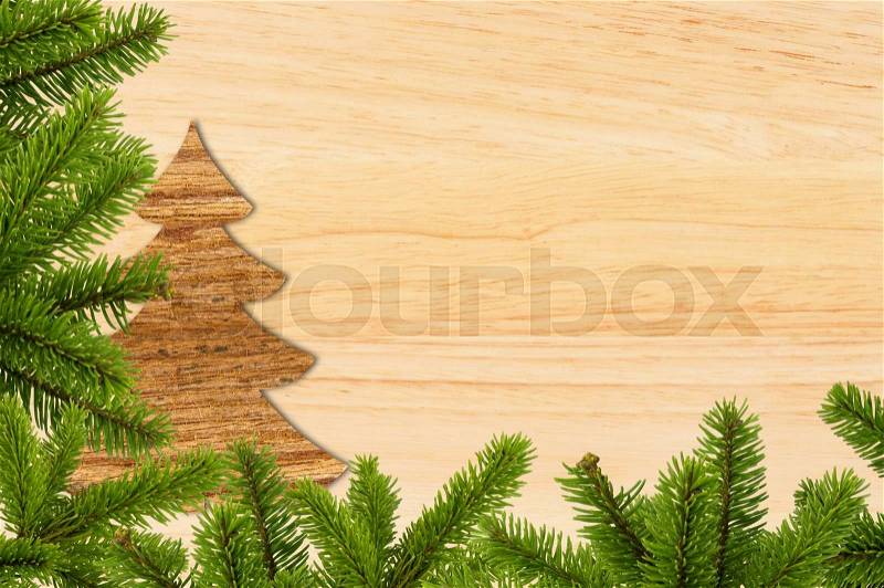 Vintage christmas background - old wood board with green christmas tree branch, stock photo
