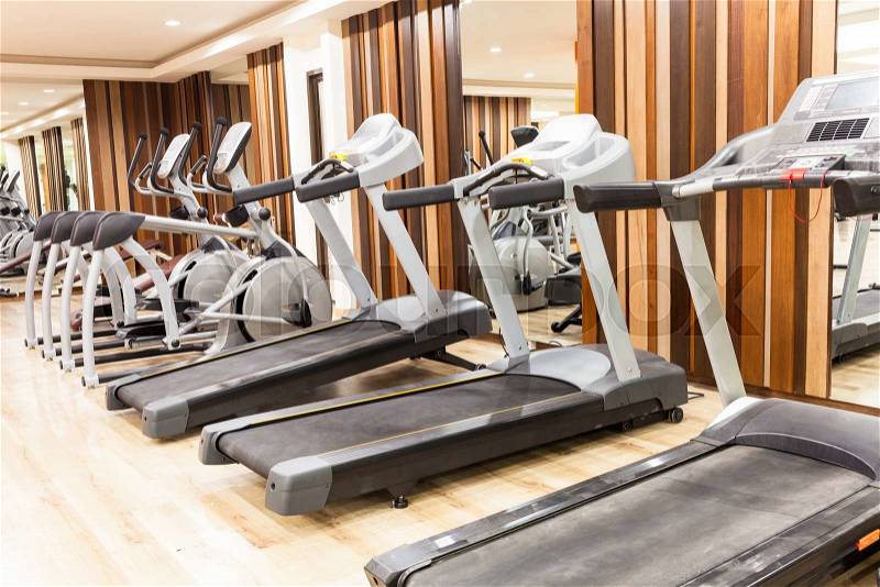Treadmill in Modern gym interior with equipment , stock photo
