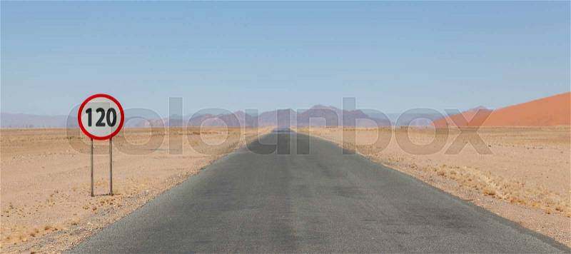 Speed limit sign at a desert road in Namibia, speed limit of 120 kph or mph, stock photo