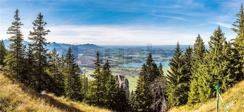 Alps and forest in a summer day in Germany. Taken from the hill next to Neuschwanstein castle, stock photo