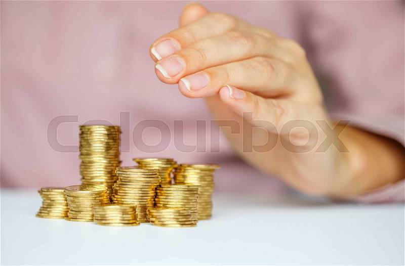 Protect new business start-up concept - with hands and coin, stock photo