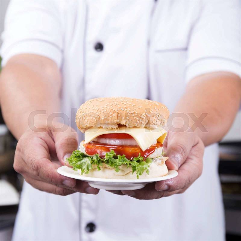 Close up Chef presented Hamburger /Cooking Hamburger concept, stock photo