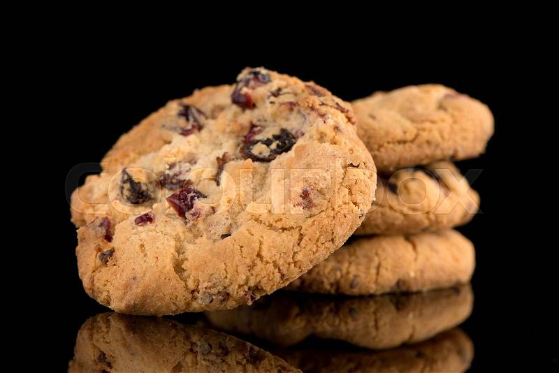 Dried fruits chip cookies isolated on black background, stock photo