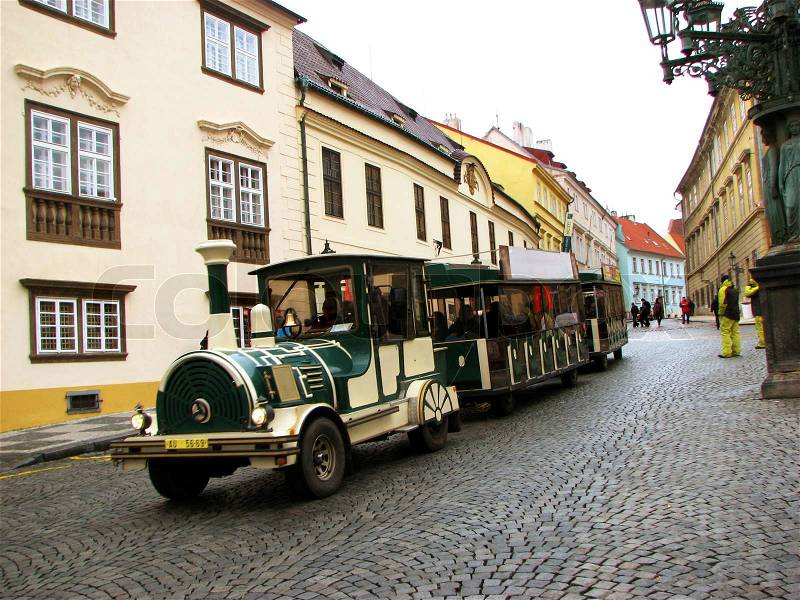 Vintage excursion green train in streets of Prague, stock photo
