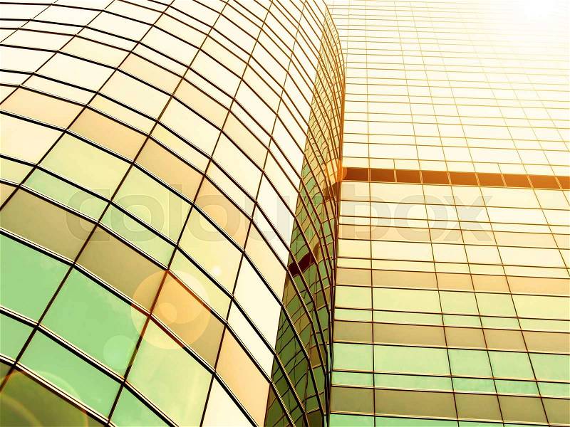 Reflections in office building with warm light sunset, stock photo